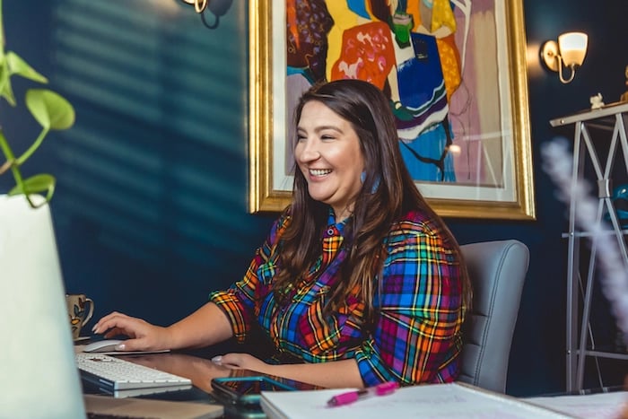 Nicole Moss of Moss Consulting at her desk