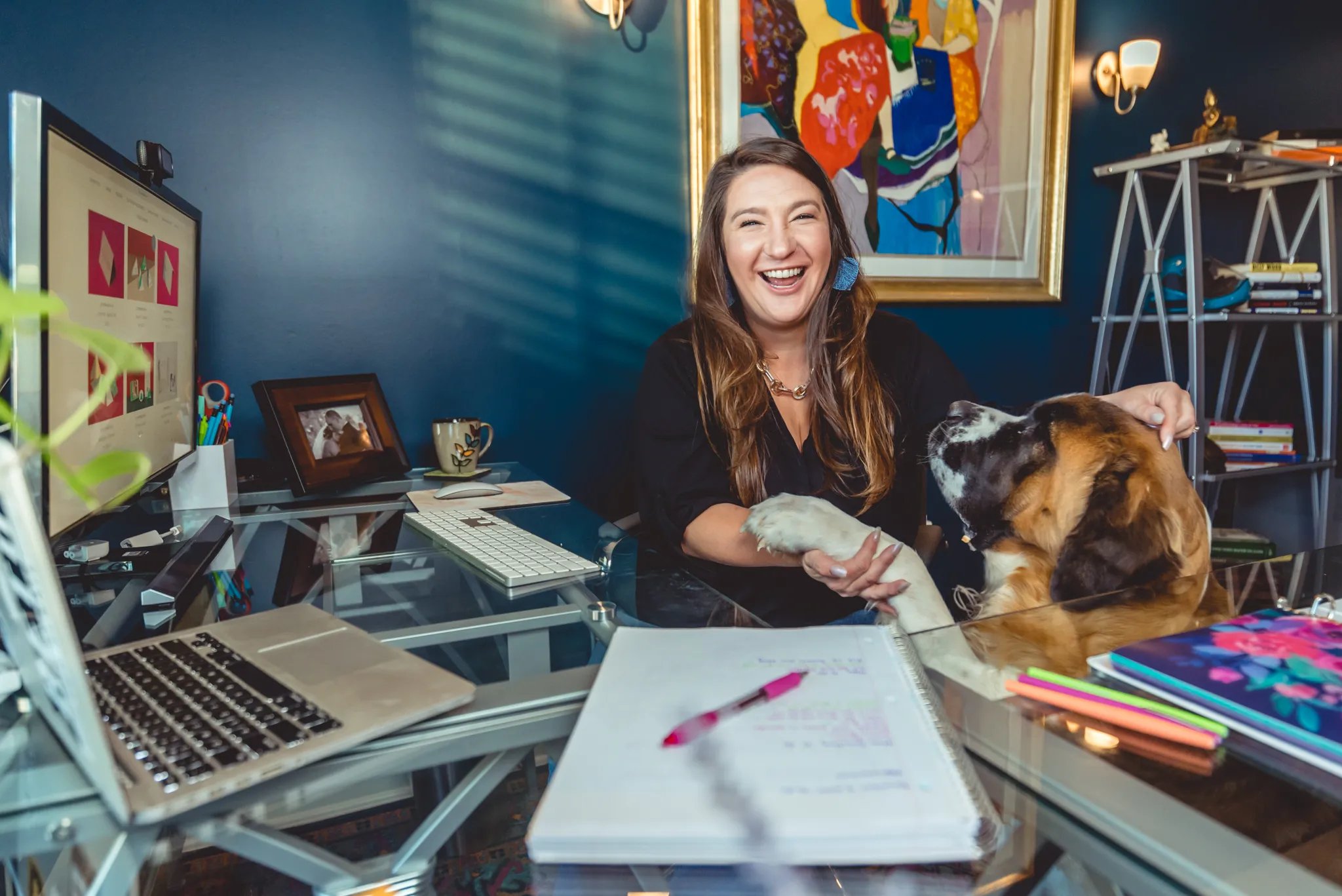 Nicole Moss at her desk in Austin, TX. Moss Consulting offers HR Outsourcing services in Austin, Dallas, and Houston