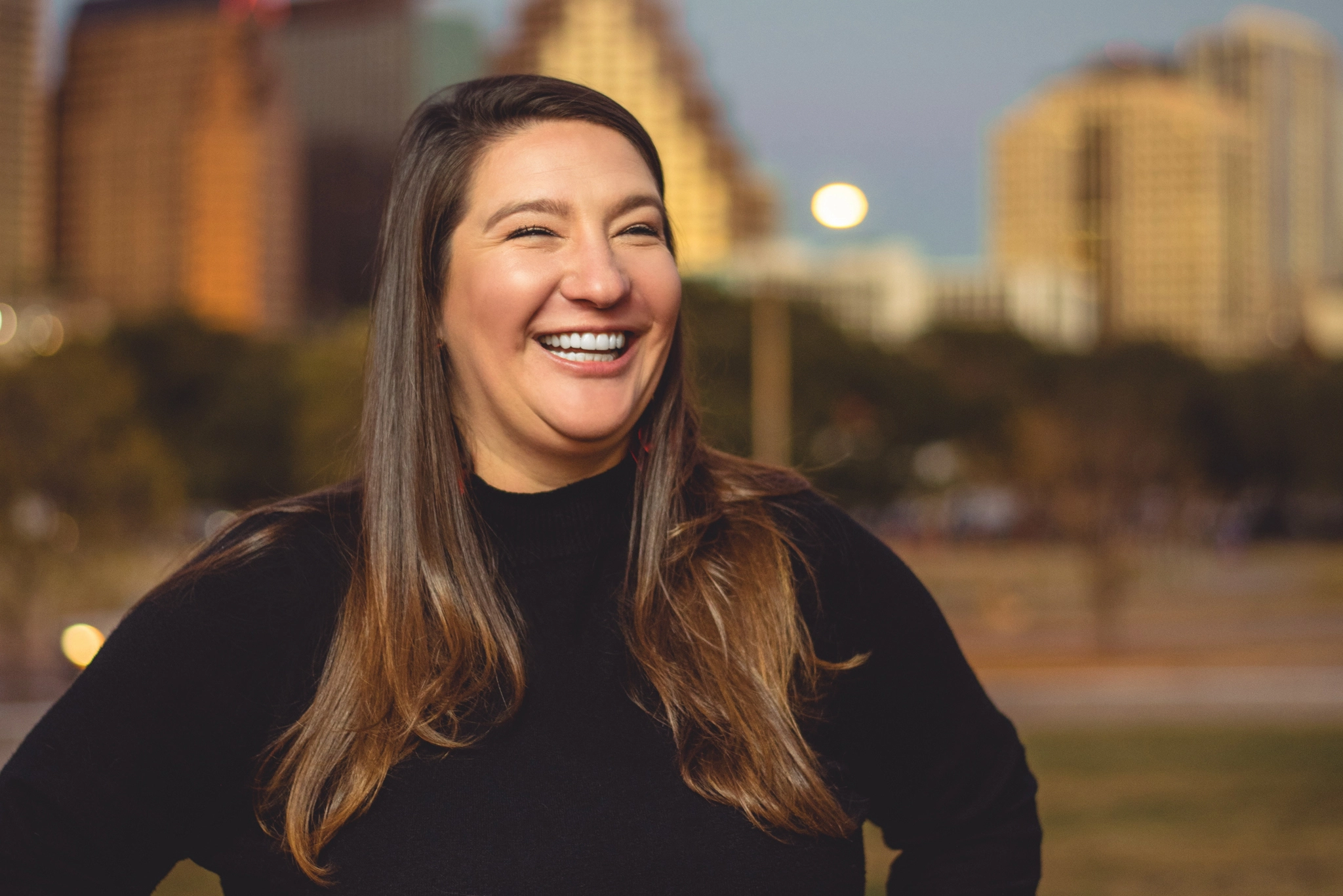 Nicole Moss of Moss Consulting smiling in downtown Austin, TX